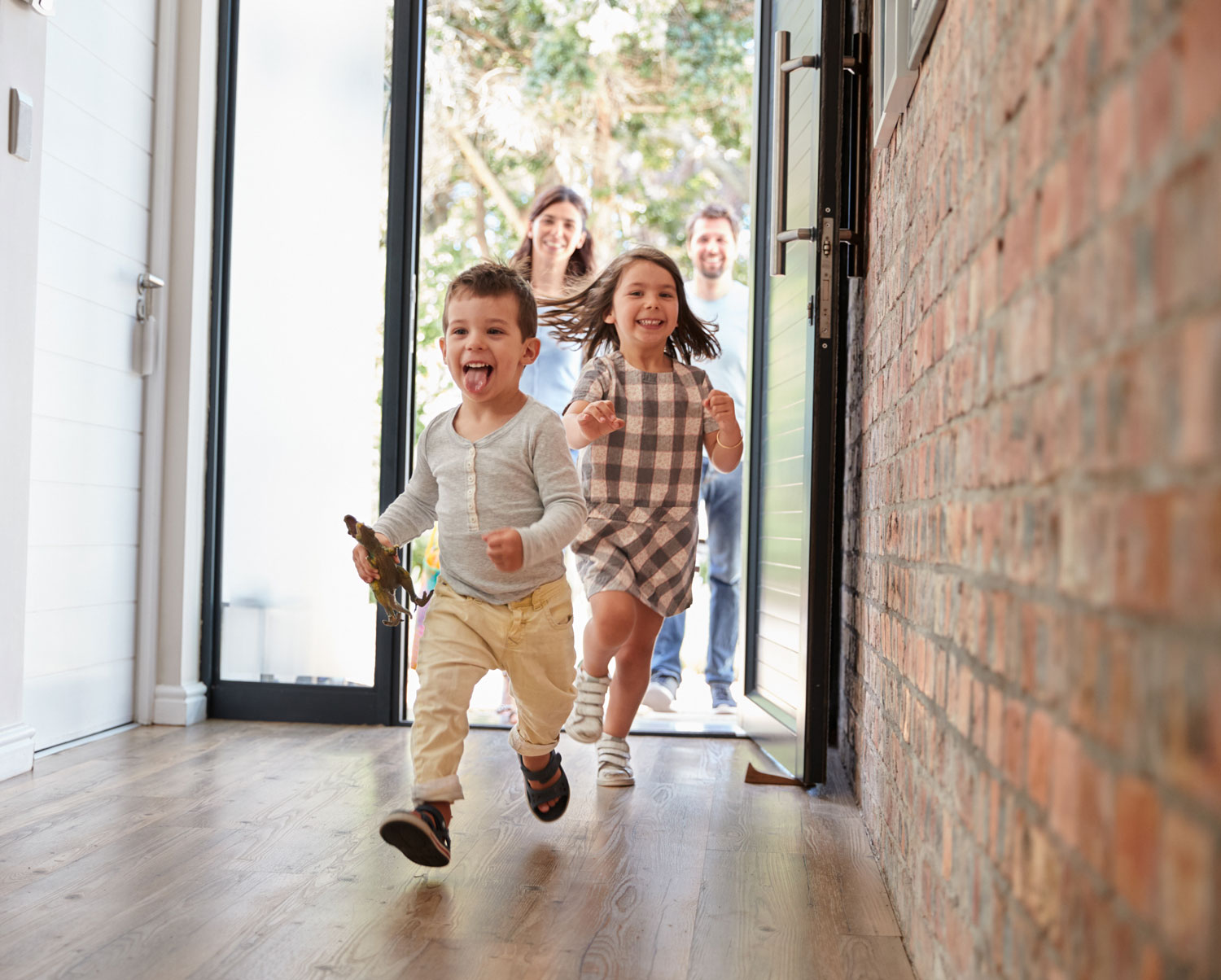 Family running through front door