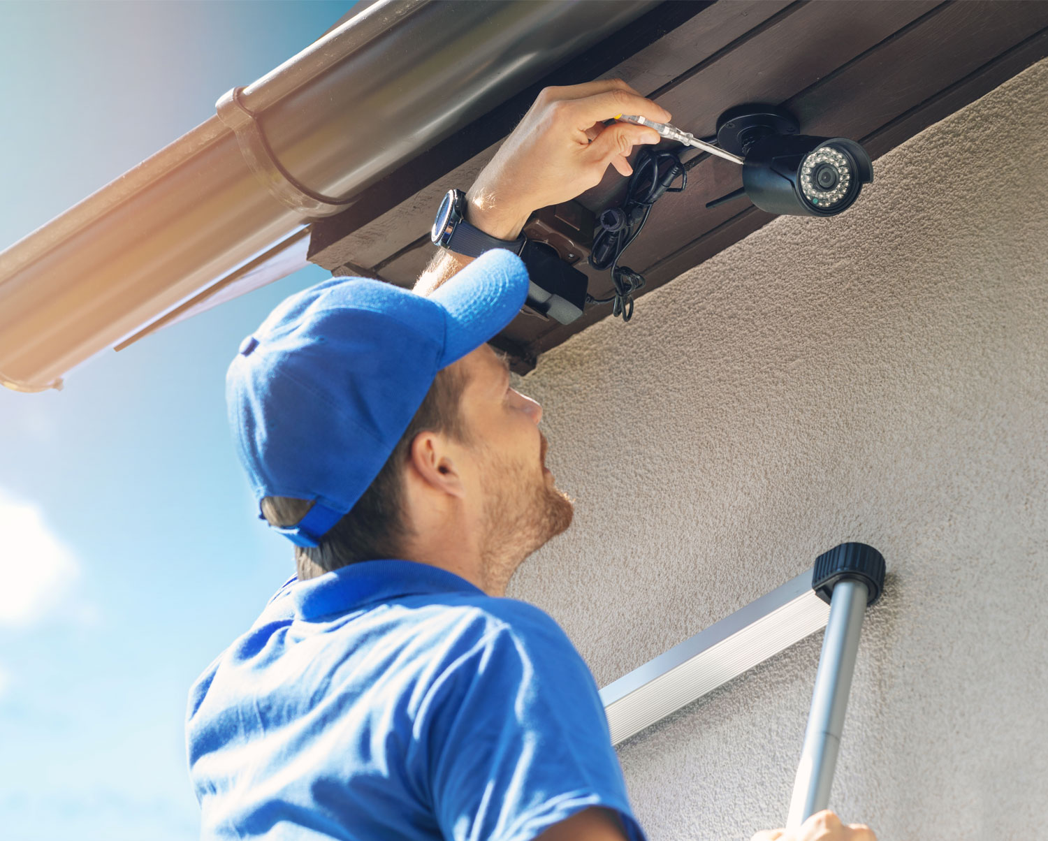 Security technician installing a video camera