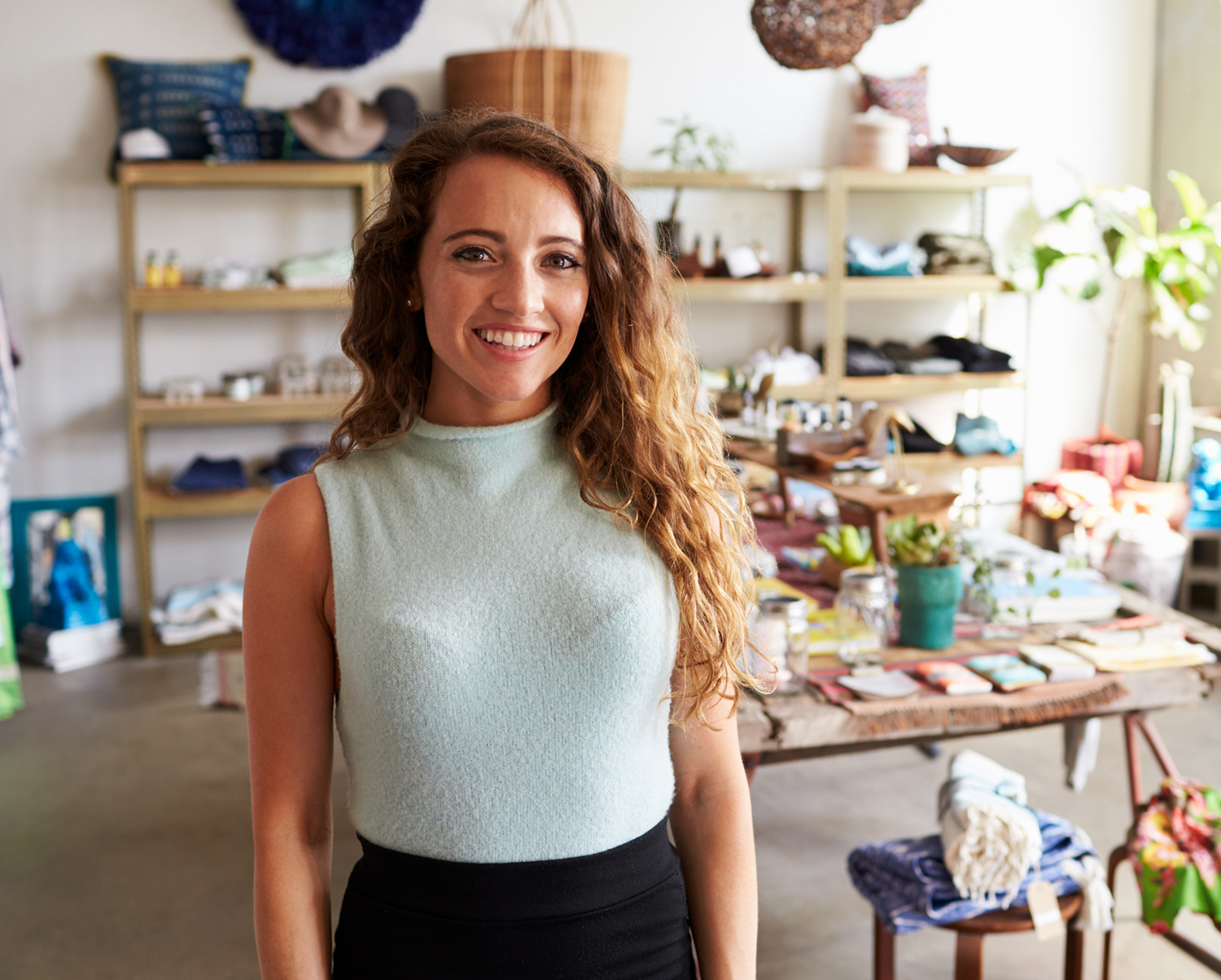 Business owner in front of her shop