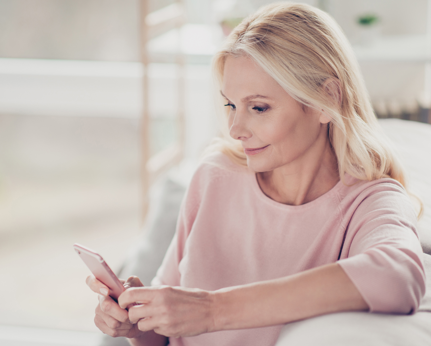 Homeowner monitoring security on phone