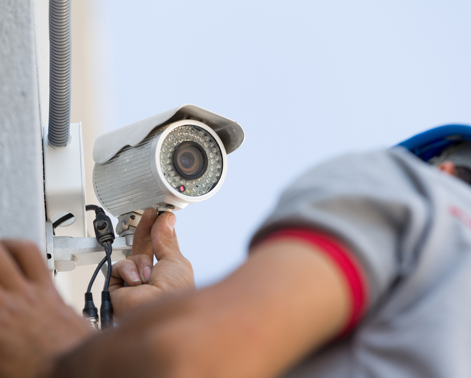 Technician installing security camera